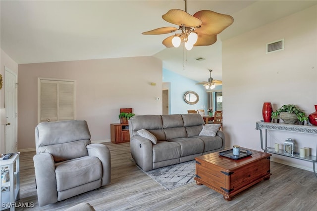 living room featuring high vaulted ceiling, ceiling fan, and light hardwood / wood-style floors