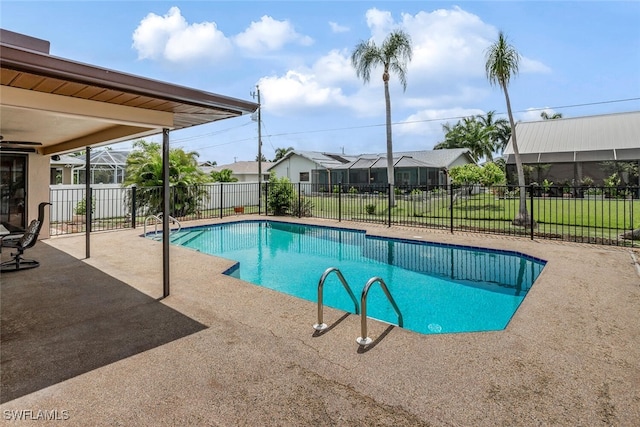 view of swimming pool with a yard and a patio area