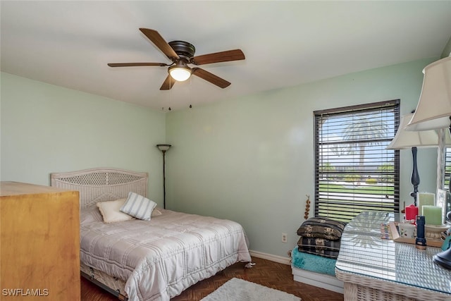 bedroom featuring dark parquet floors and ceiling fan