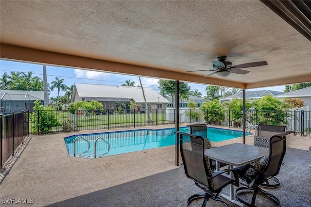 view of pool with a patio area and ceiling fan