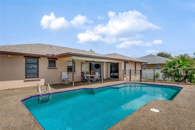 view of swimming pool with a patio area