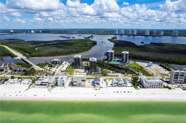 birds eye view of property featuring a view of the beach and a water view