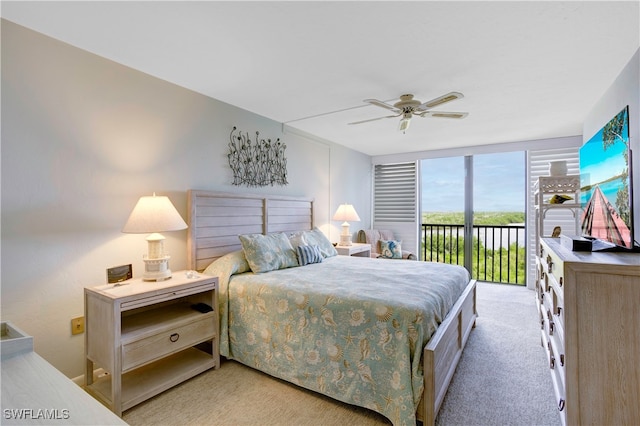 bedroom featuring light carpet, ceiling fan, and access to outside