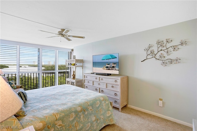 carpeted bedroom with ceiling fan and access to exterior