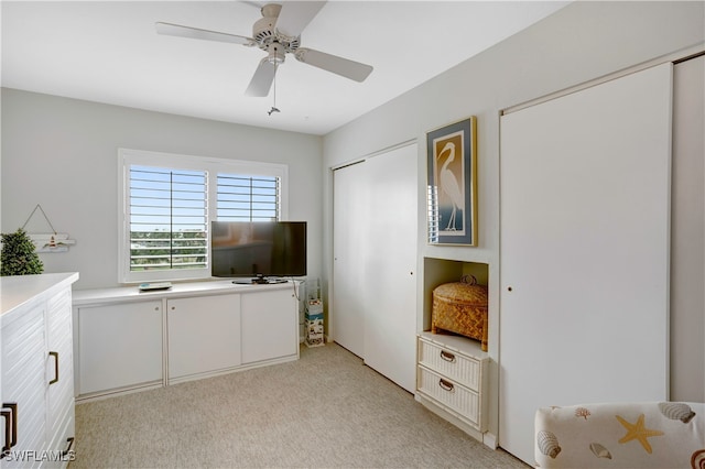 interior space featuring ceiling fan