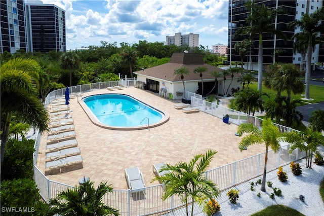 view of swimming pool with a patio area