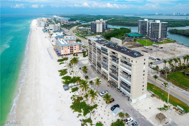 birds eye view of property with a view of the beach and a water view