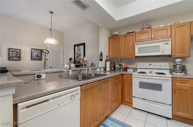 9025 Colby Dr Unit 2120, Fort Myers, FL 33919 - kitchen with decorative light fixtures, white appliances, light tile patterned floors, kitchen peninsula, and sink