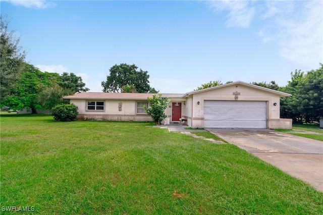 ranch-style home with a garage and a front lawn