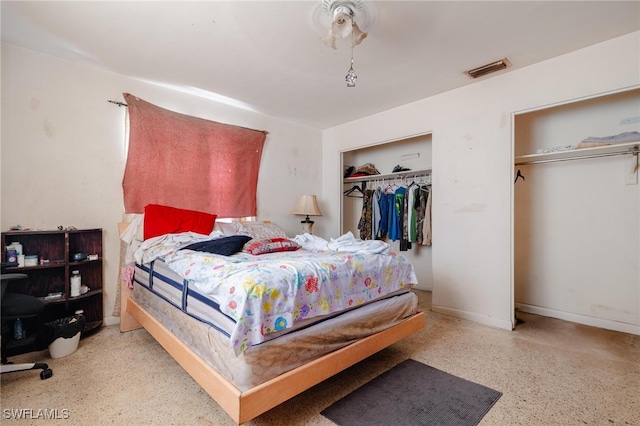 bedroom with two closets