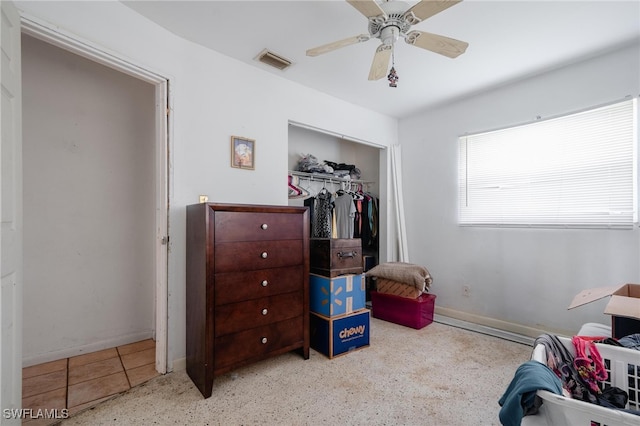 bedroom with ceiling fan and a closet