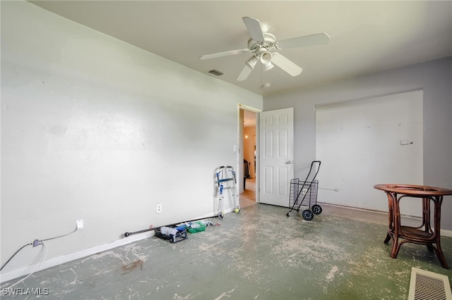 miscellaneous room with concrete floors and ceiling fan