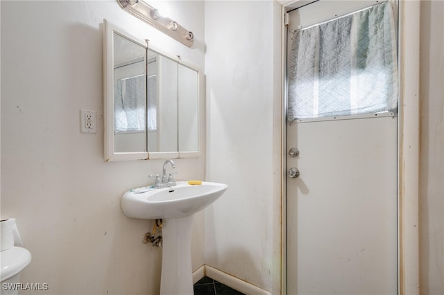 bathroom featuring toilet and a wealth of natural light