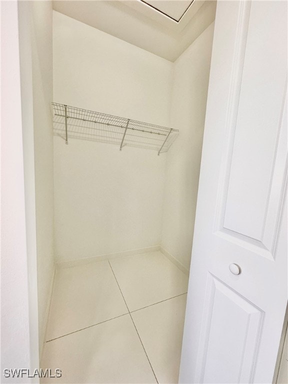 spacious closet with tile patterned flooring