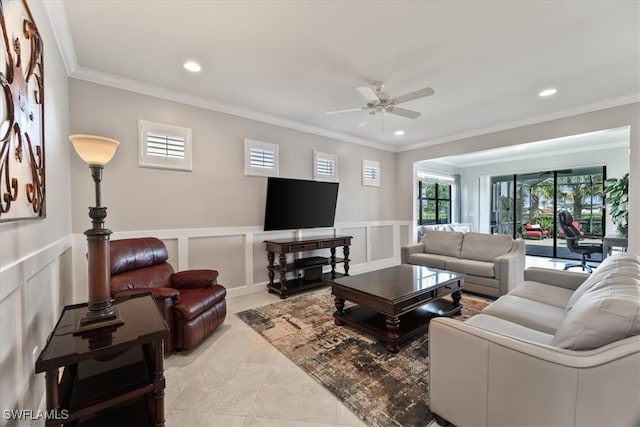 living room featuring ornamental molding and ceiling fan