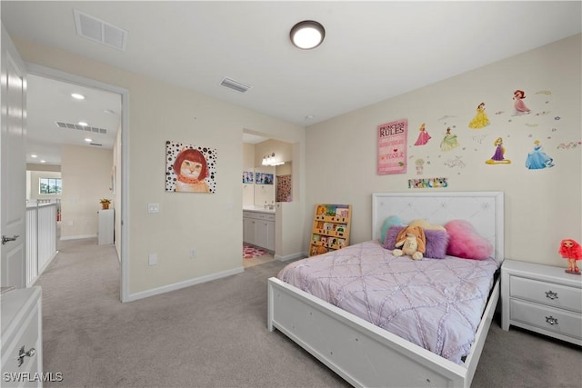 carpeted bedroom with connected bathroom