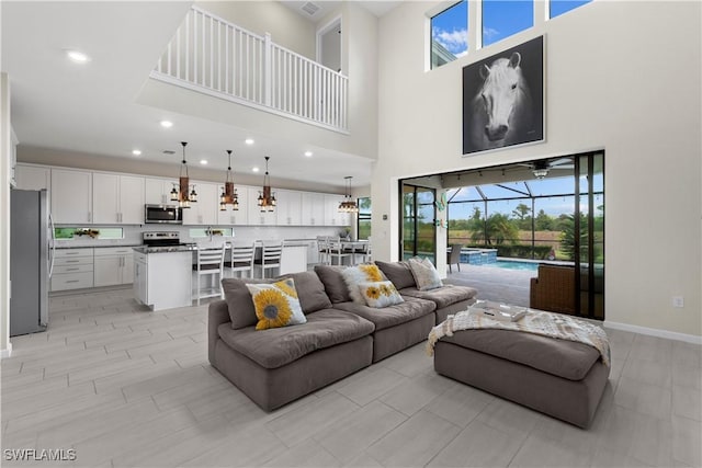 living room featuring a high ceiling