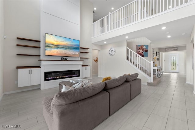 living room featuring a high ceiling