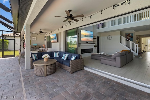 view of patio featuring outdoor lounge area and a lanai