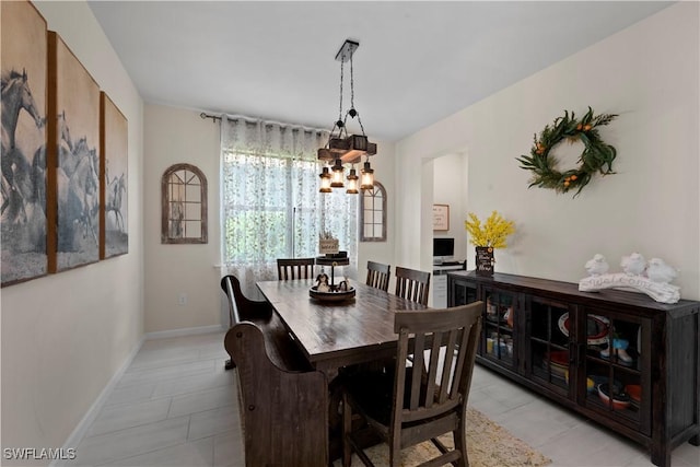 dining area featuring an inviting chandelier