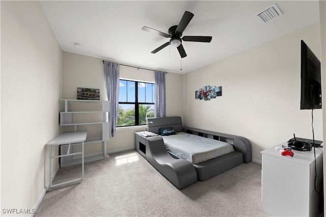 carpeted bedroom with ceiling fan