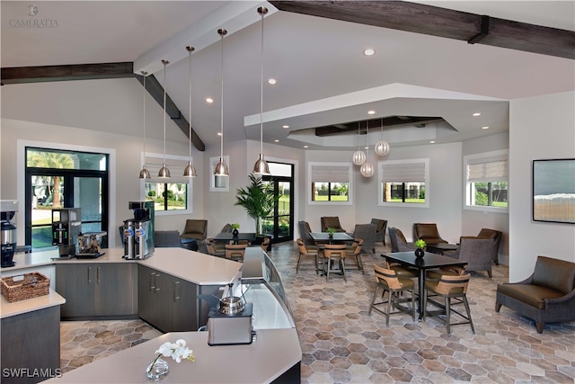 interior space featuring beam ceiling, high vaulted ceiling, and french doors