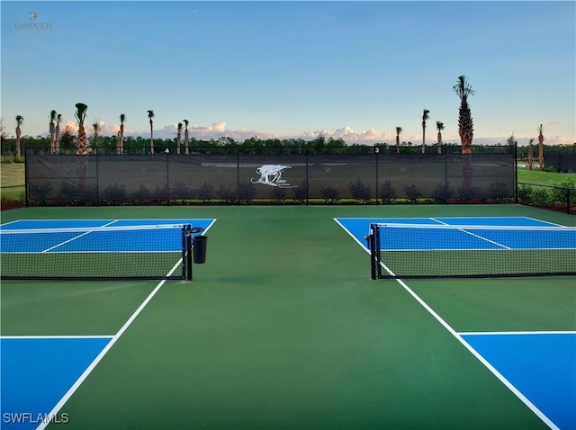 view of sport court with basketball hoop