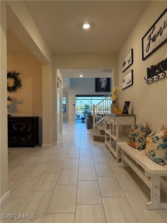 hallway featuring light tile patterned flooring