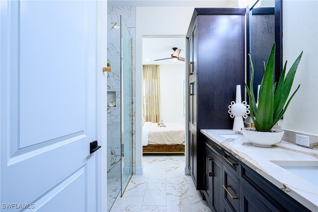 bathroom with vanity, ceiling fan, and an enclosed shower