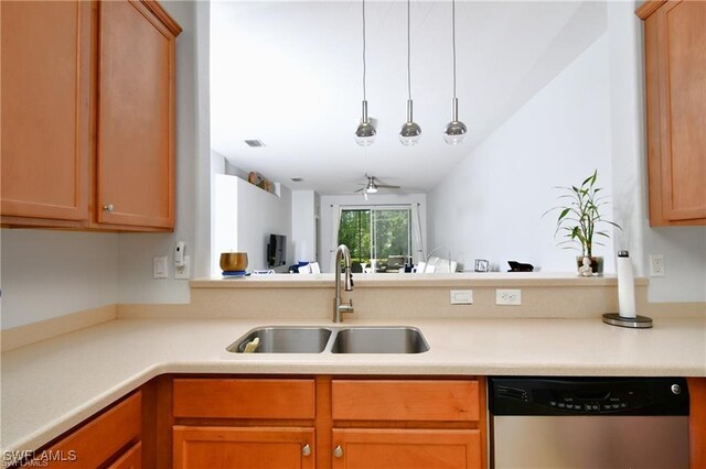 kitchen featuring dishwasher, vaulted ceiling, decorative light fixtures, sink, and ceiling fan