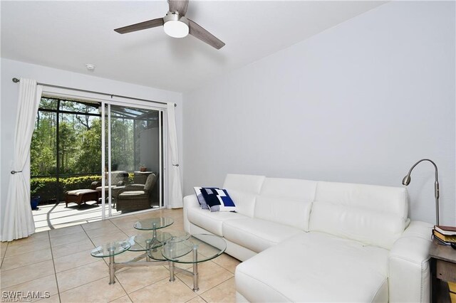 living room featuring ceiling fan and light tile patterned floors