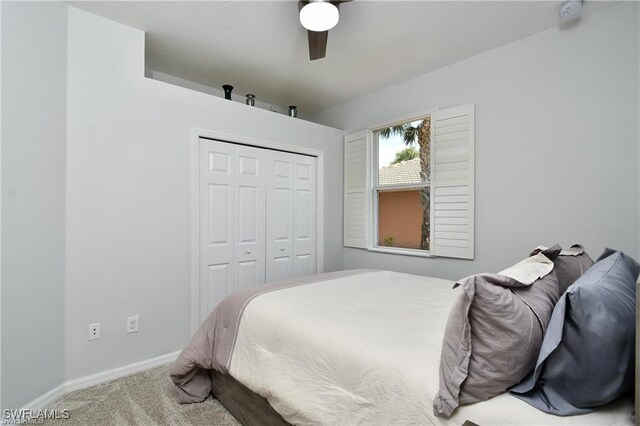 bedroom with a closet, ceiling fan, and carpet floors