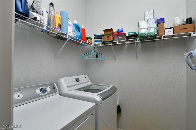 washroom with washer and dryer