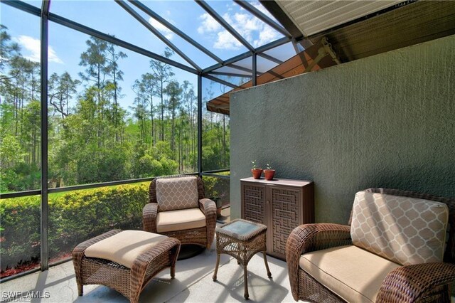 sunroom / solarium featuring a wealth of natural light and vaulted ceiling