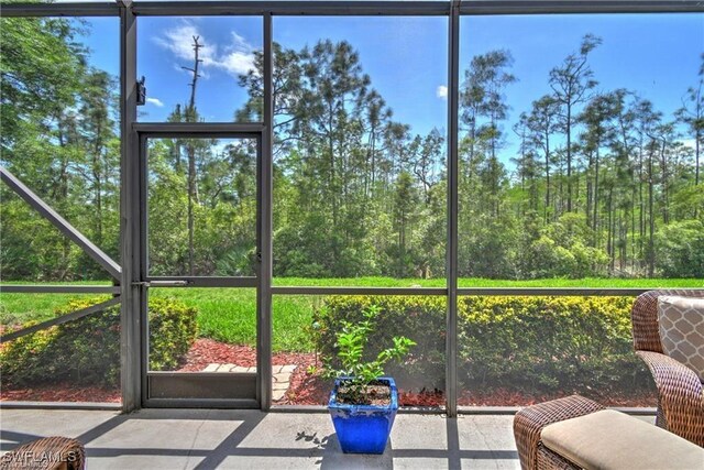 unfurnished sunroom with plenty of natural light