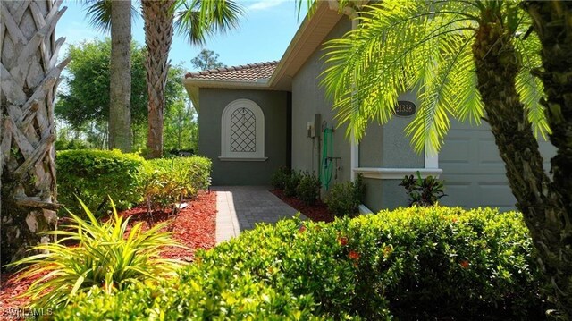 entrance to property featuring a garage