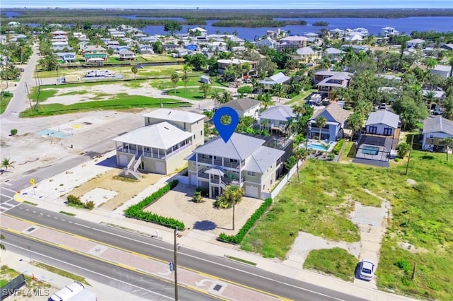 aerial view featuring a residential view and a water view