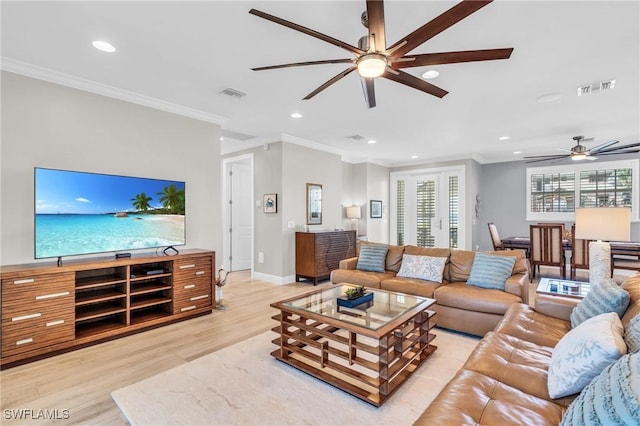 living area featuring recessed lighting, visible vents, crown molding, and light wood-style flooring