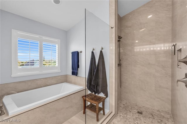 full bath featuring vaulted ceiling, tiled shower, and a bath