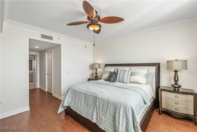 bedroom featuring crown molding, hardwood / wood-style flooring, and ceiling fan