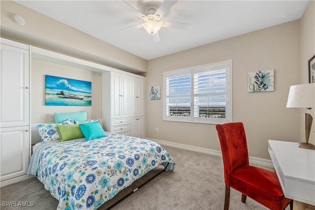 bedroom with a closet, light colored carpet, and ceiling fan