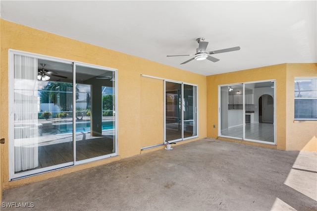 view of patio featuring ceiling fan