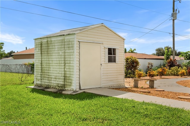 view of outdoor structure featuring a yard