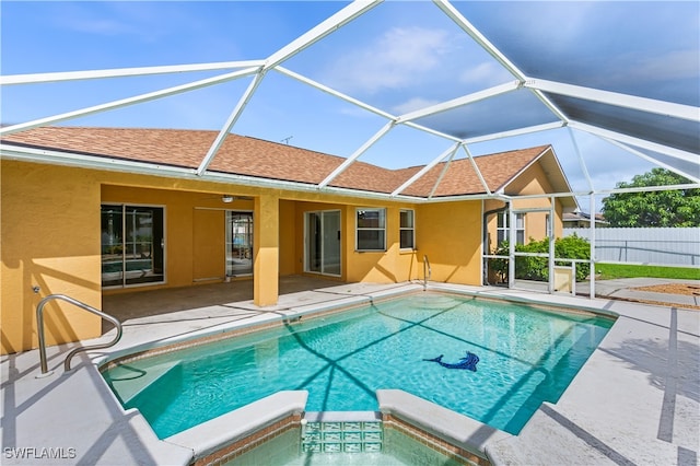 view of pool with a patio area and a lanai