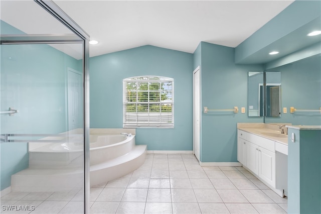 bathroom with tile patterned flooring, vaulted ceiling, plus walk in shower, and vanity