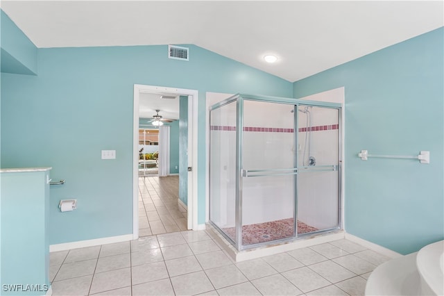 bathroom featuring lofted ceiling, a shower with shower door, ceiling fan, and tile patterned floors