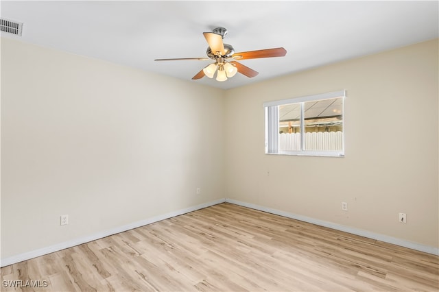 empty room featuring ceiling fan and light hardwood / wood-style floors