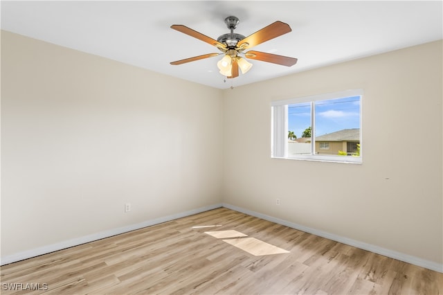 empty room with light hardwood / wood-style flooring and ceiling fan