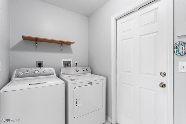 laundry room featuring washing machine and dryer