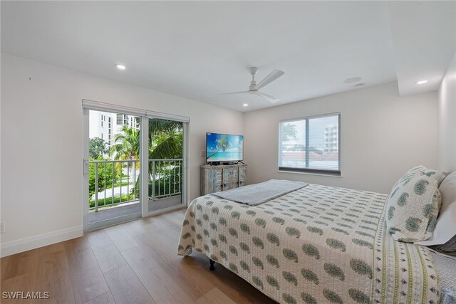 bedroom with access to exterior, ceiling fan, light hardwood / wood-style flooring, and multiple windows